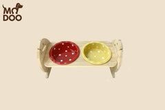 Polka dot patterned ceramic cat bowl with an adjustable bamboo stand for cats and small dogs