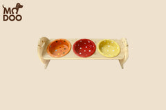 Polka dot patterned ceramic cat bowl with an adjustable bamboo stand for cats and small dogs