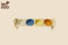Polka dot patterned ceramic cat bowl with an adjustable bamboo stand for cats and small dogs